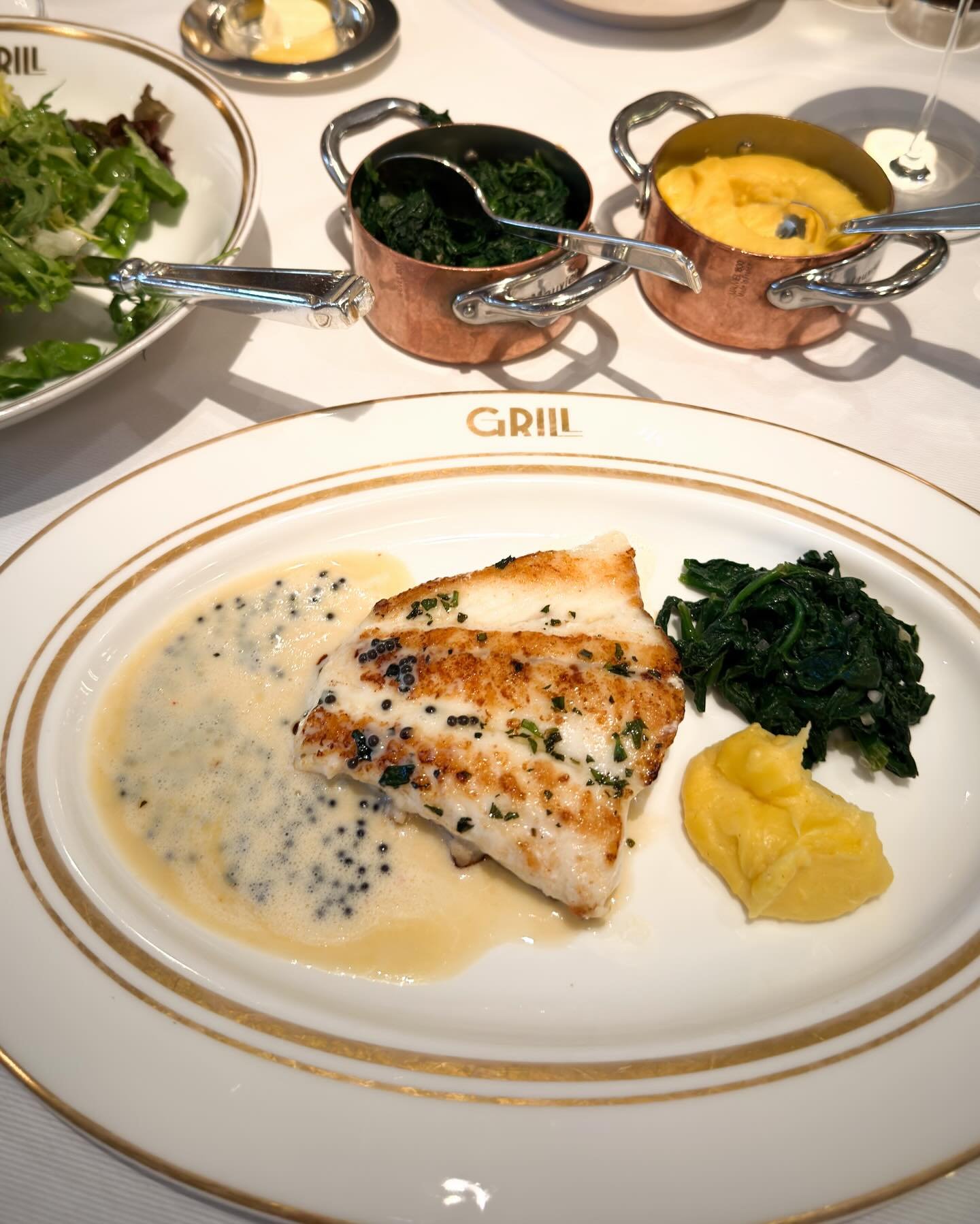 Turbot, caviar beurre blanc, side orders. Recently at the &quot;Grill&quot; of Fairmont Hotel Vier Jahreszeiten in Hamburg. 
&mdash; 
#grill #hvj #hamburg #hotelvierjahreszeiten @fairmont_hotelvierjahreszeiten 
.
.
#mystorywithmichelin #michelinplate