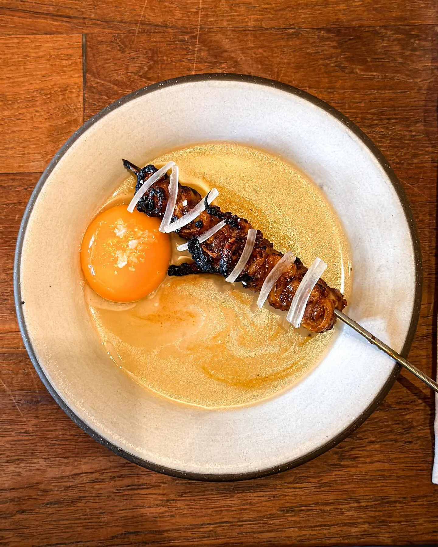 Grilled squid skewer, piment&oacute;n, hazelnut, egg yolk. (Crazy good.) At Michelin-starred "The Four Horsemen" in Brooklyn. 
&mdash; 
#onemichelinstar #troisetoiles_ny @fourhorsemenbk