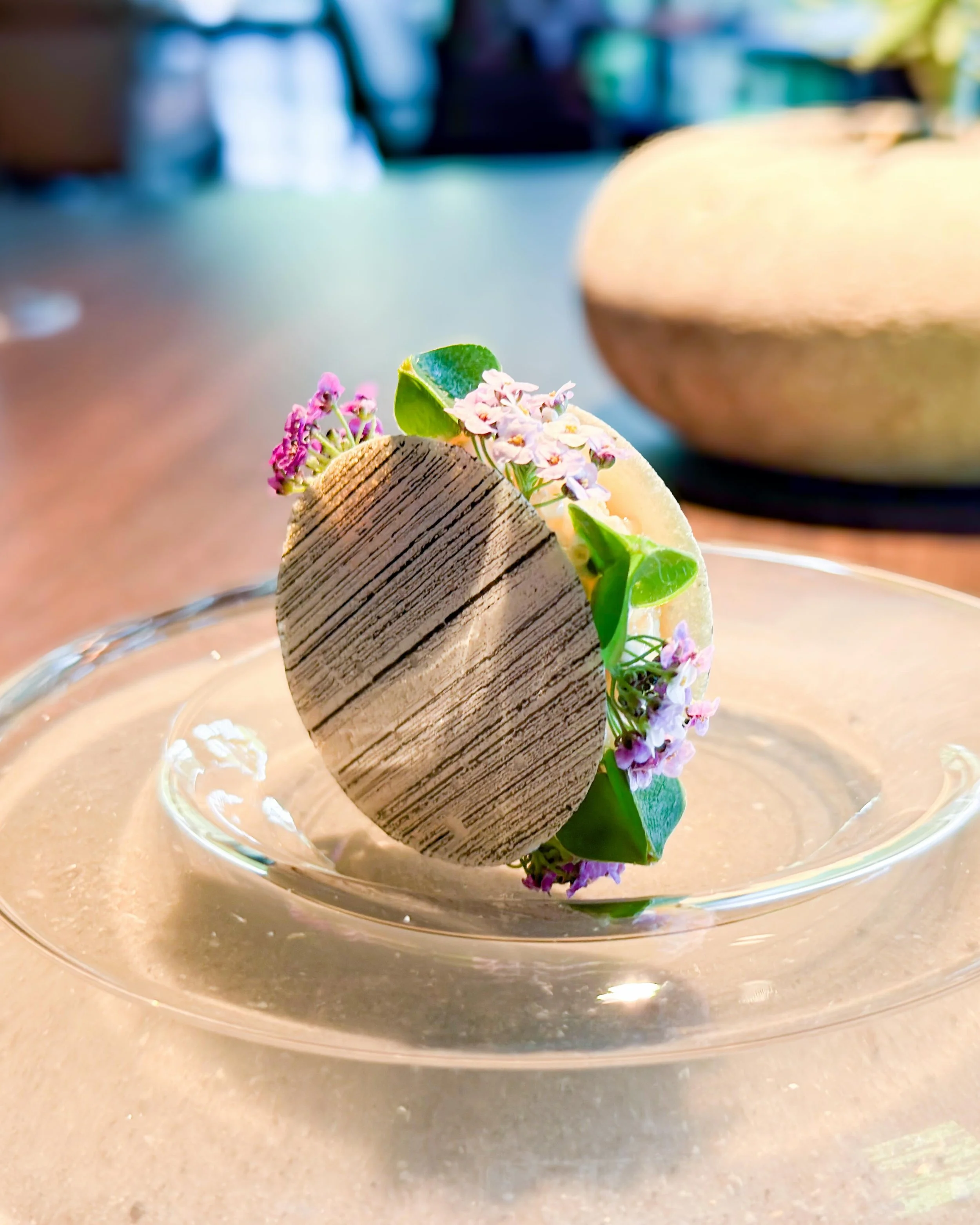L&ouml;jrom (vendace roe), fresh cheese, roasted birch. 

Precisely executed &mdash; citrussy, crunchy, cool and floral. An excellent first bite at two-Michelin-starred @frederikshoj in Aarhus, Denmark.
&mdash; 
#twomichelinstars #troisetoiles_dk