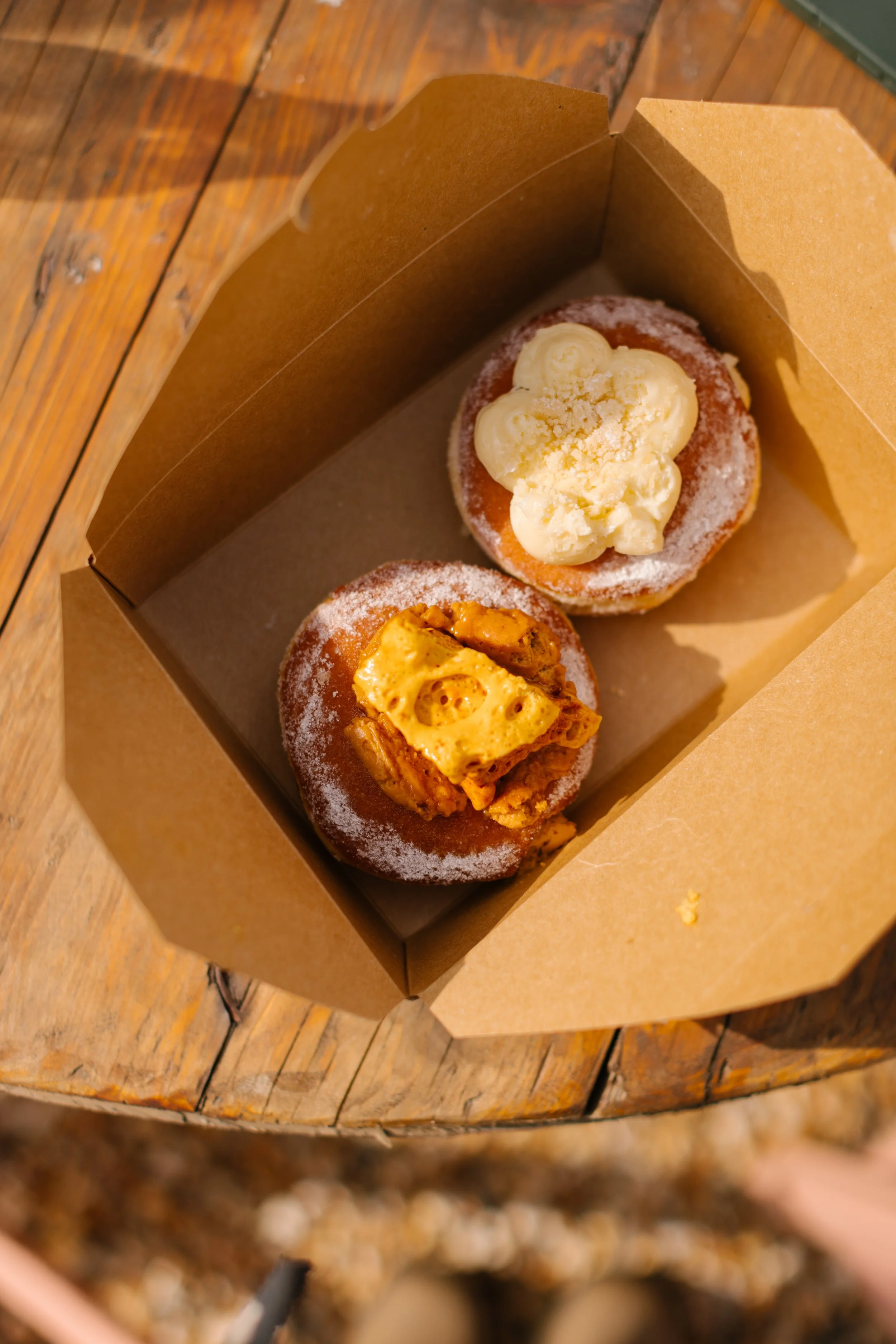 An image of two delicious Kinsbrook pastries in a takeaway box