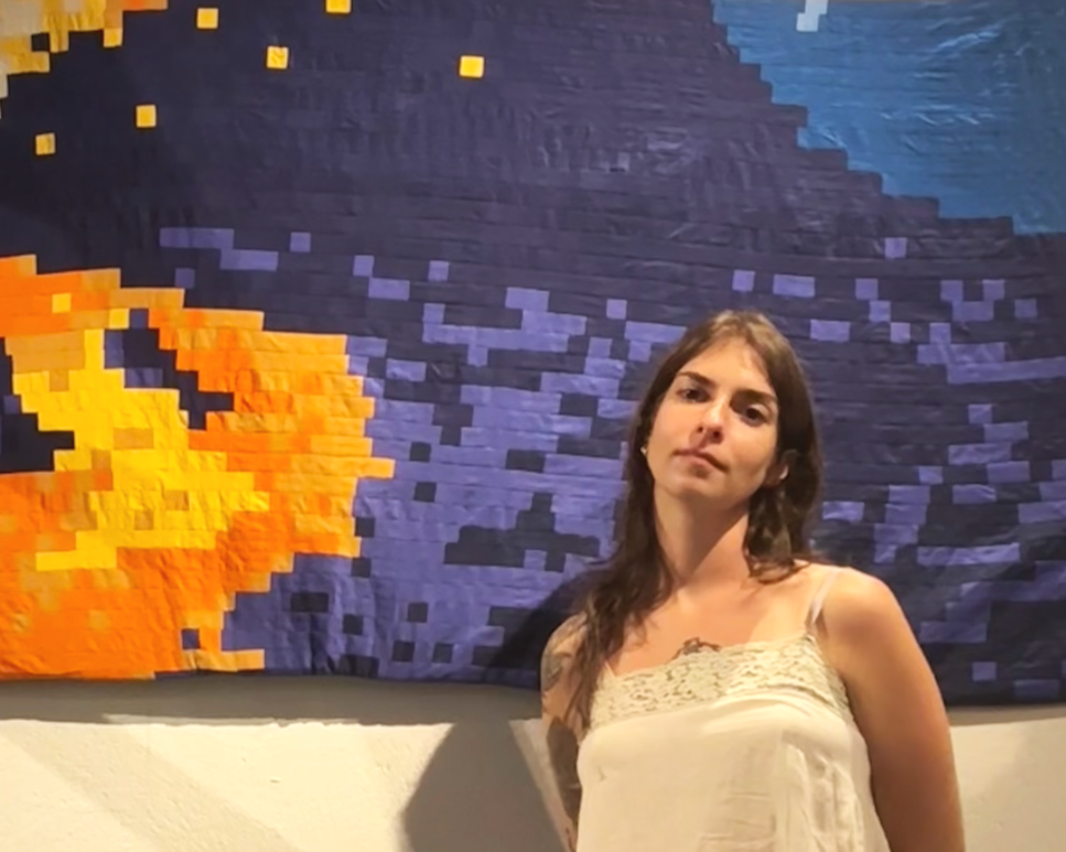 New York based artist and quilter Libby Prosser with her 2025 piece Erupt, included in 'Liminal Gestures' exhibition at Theater for the New City, 2025