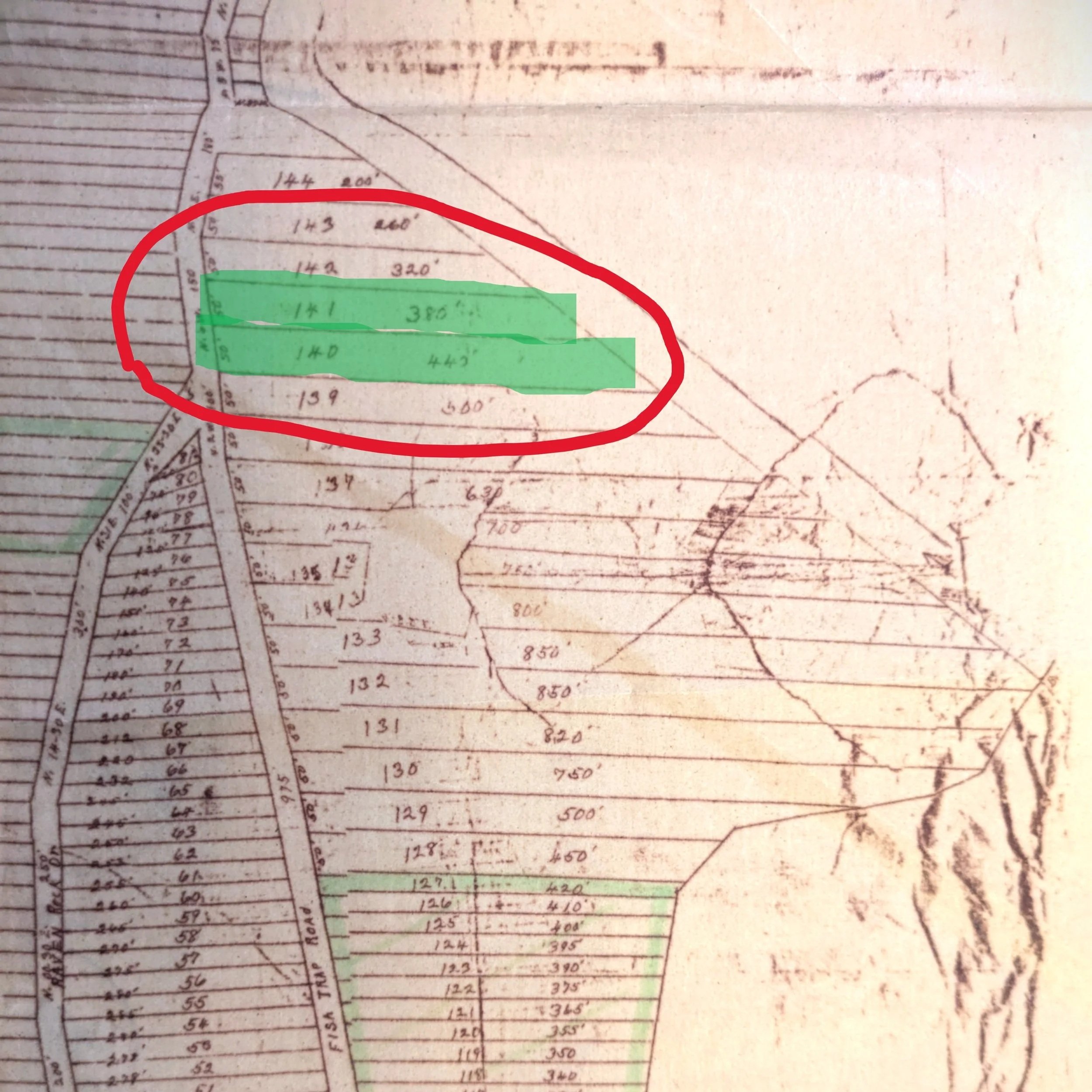 A detailed map or blueprint showing land plots with numbers and measurements. Three adjacent plots are highlighted in green and outlined in red.