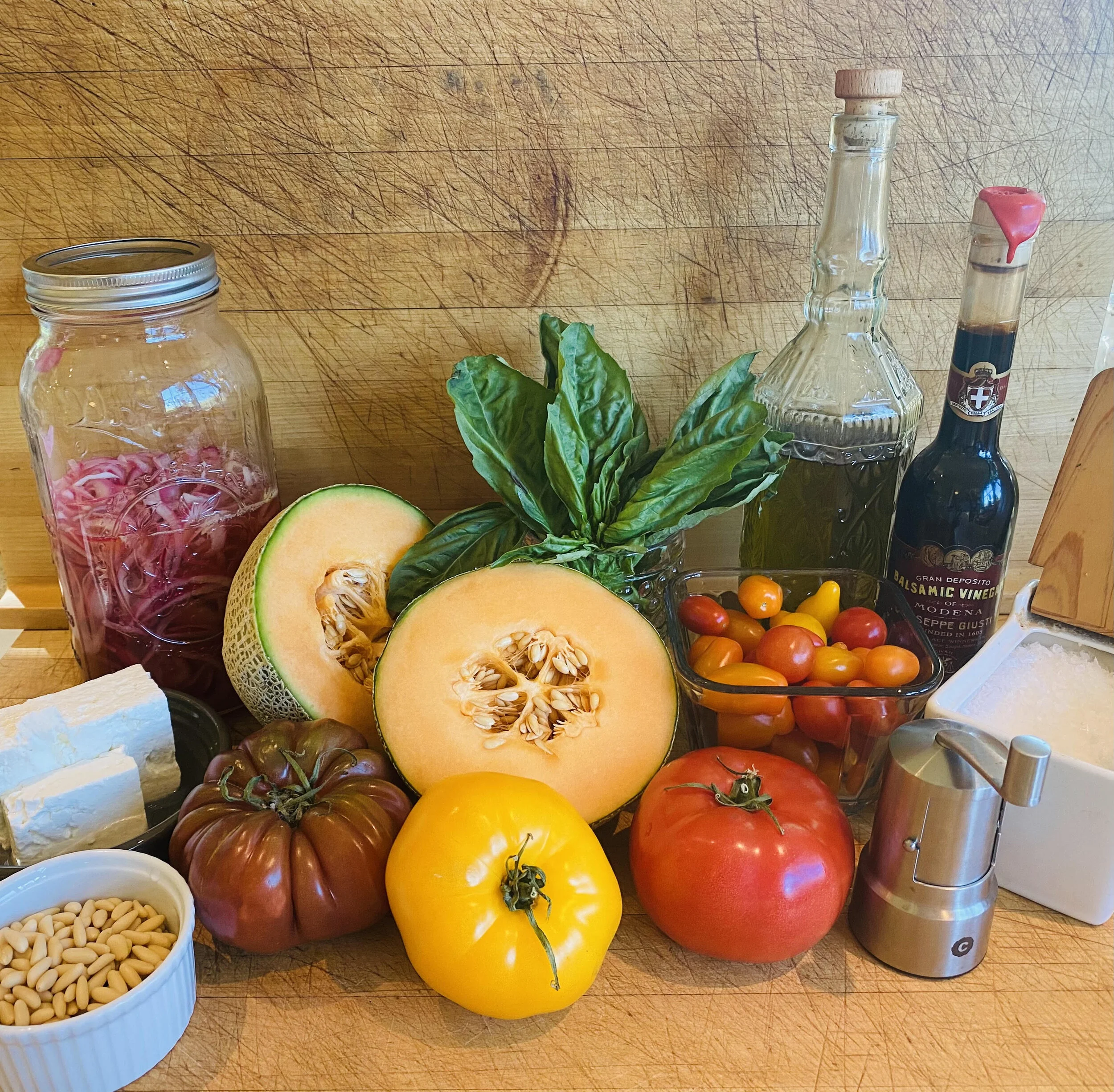 Melon, Tomato, Basil, and Feta Salad with Pickled Red Onions