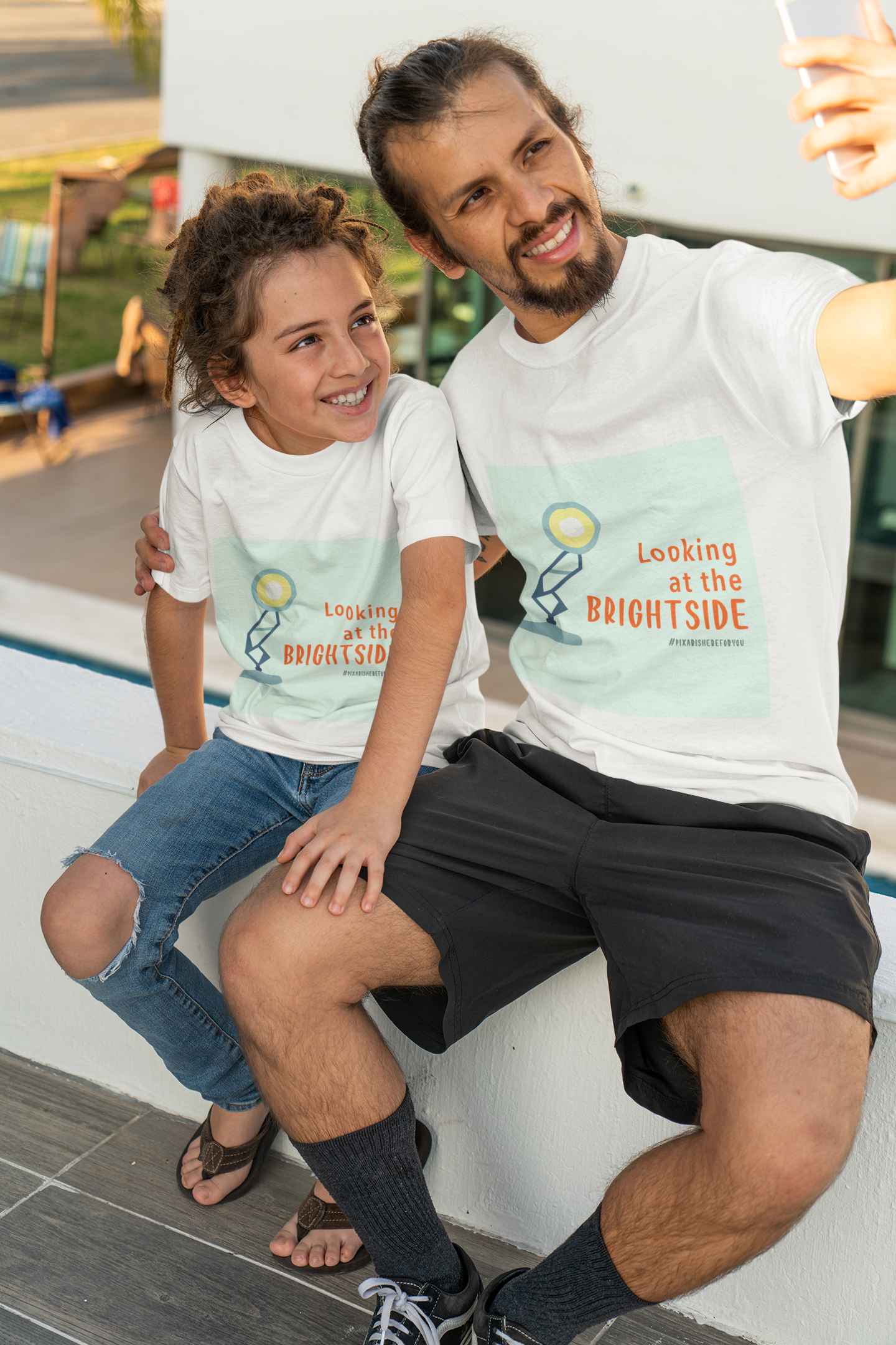 t-shirt-mockup-of-a-man-taking-a-selfie-with-his-kid-36766.png