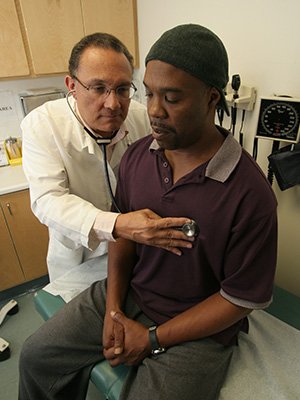 Image of client receiving a medical exam