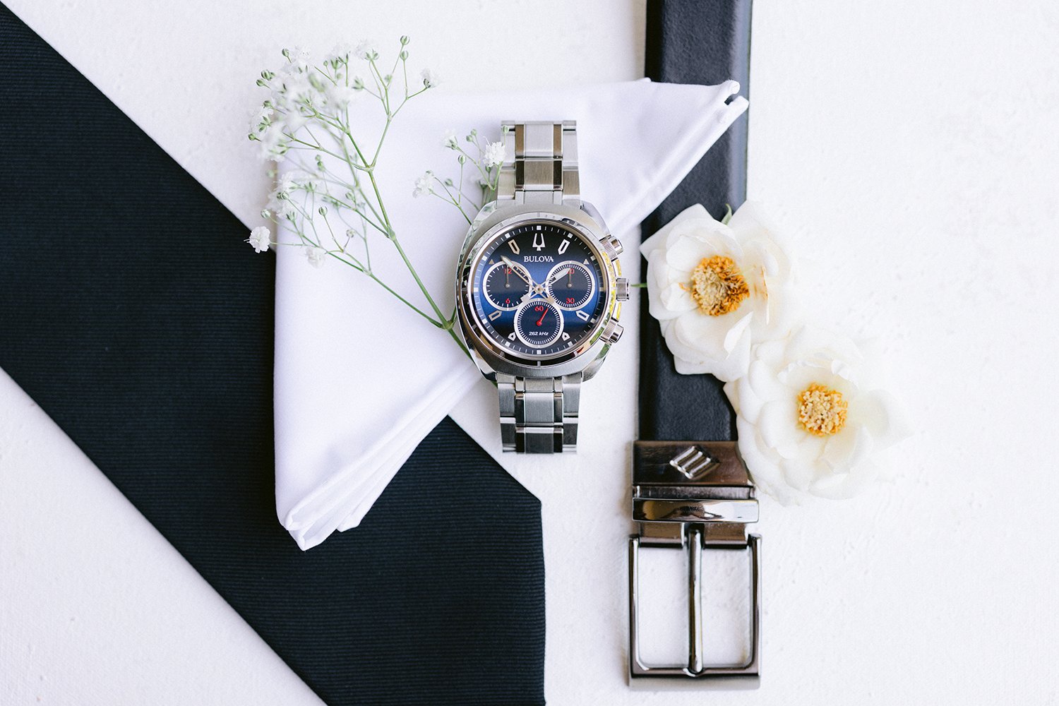 17 detail flatlay photography of groom's accesories for the wedding, bulova watch, belt and tie at Dreams Riviera Cancun.JPG