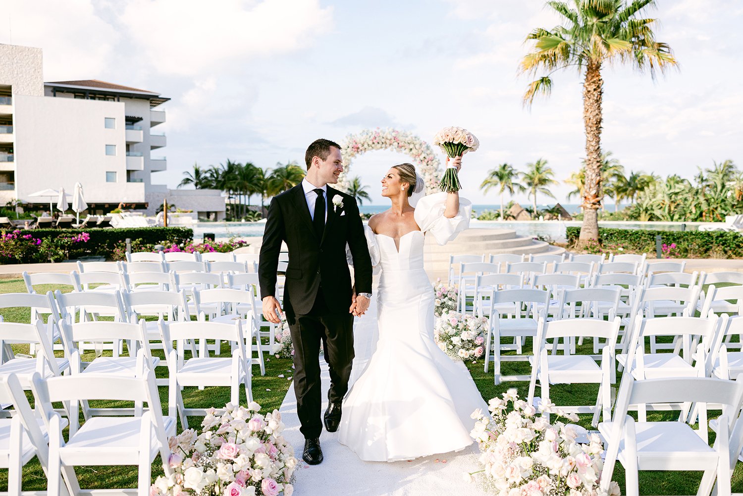 39 cute bride and groom session after wedding ceremony walking forward smiling at Dreams Riviera Cancun.JPG