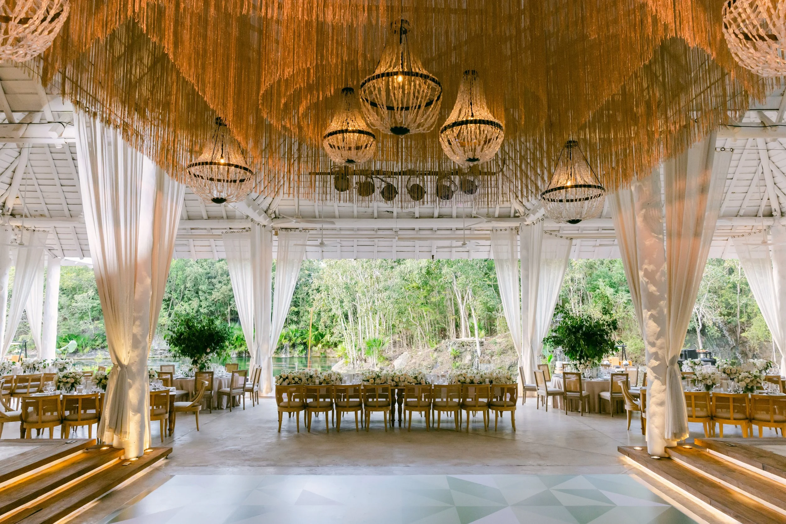 27 Incredible wedding set up reception decoration with white flowers and chandeliers at Banyan tree Mayakoba Riviera Maya.jpg