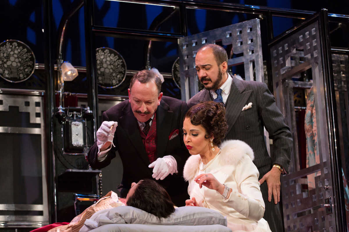  Max von Essen (in bed), with (clockwise from left), Allan Corduner, Evan Zes, and Alexandra Silber in Murder on the Orient Express at McCarter Theatre. Photo: T. Charles Erickson 