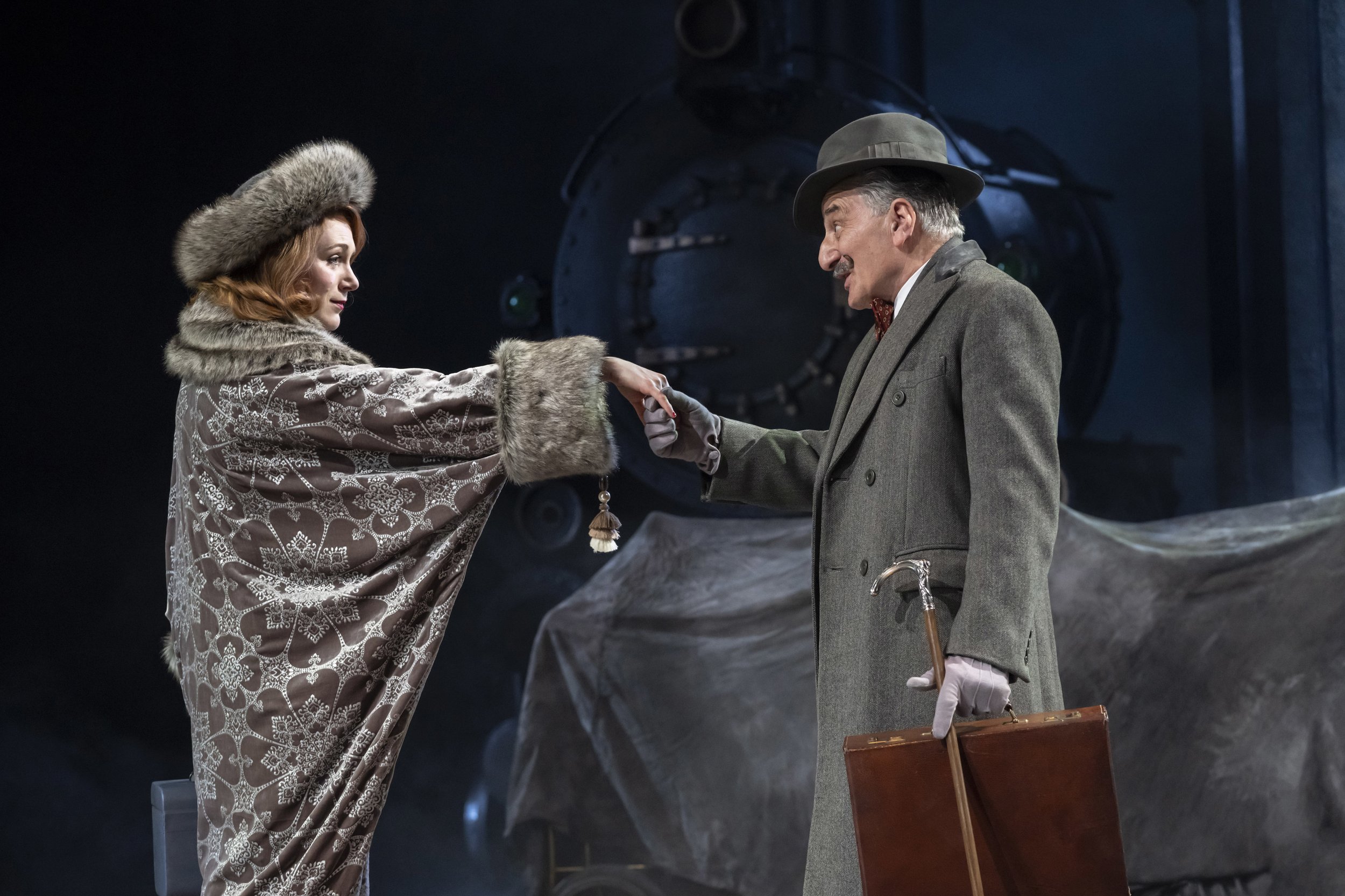 Laura Rogers as Countess Andrenyi &amp; Henry Goodman as Hercule Poirot in Murder on the Orient Express at Chichester Festival Theatre