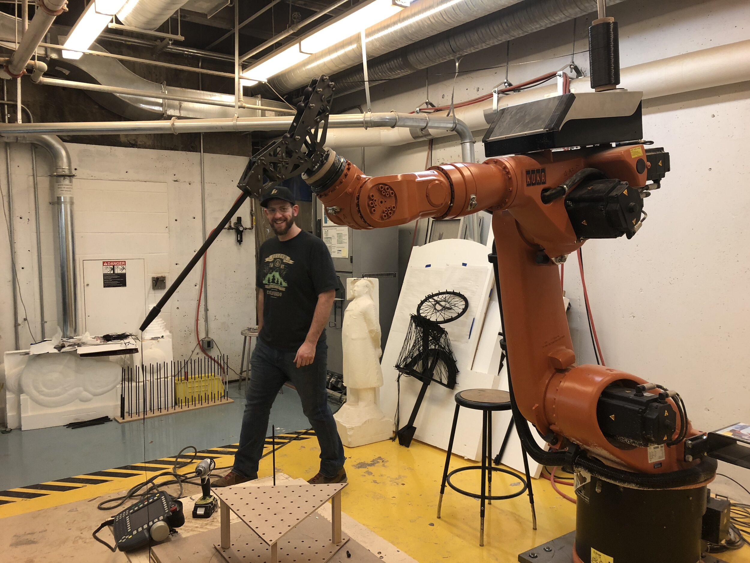  Nathan Burnell at The YSoA Robotic Lab fabricating the first metal version of the end effector. 