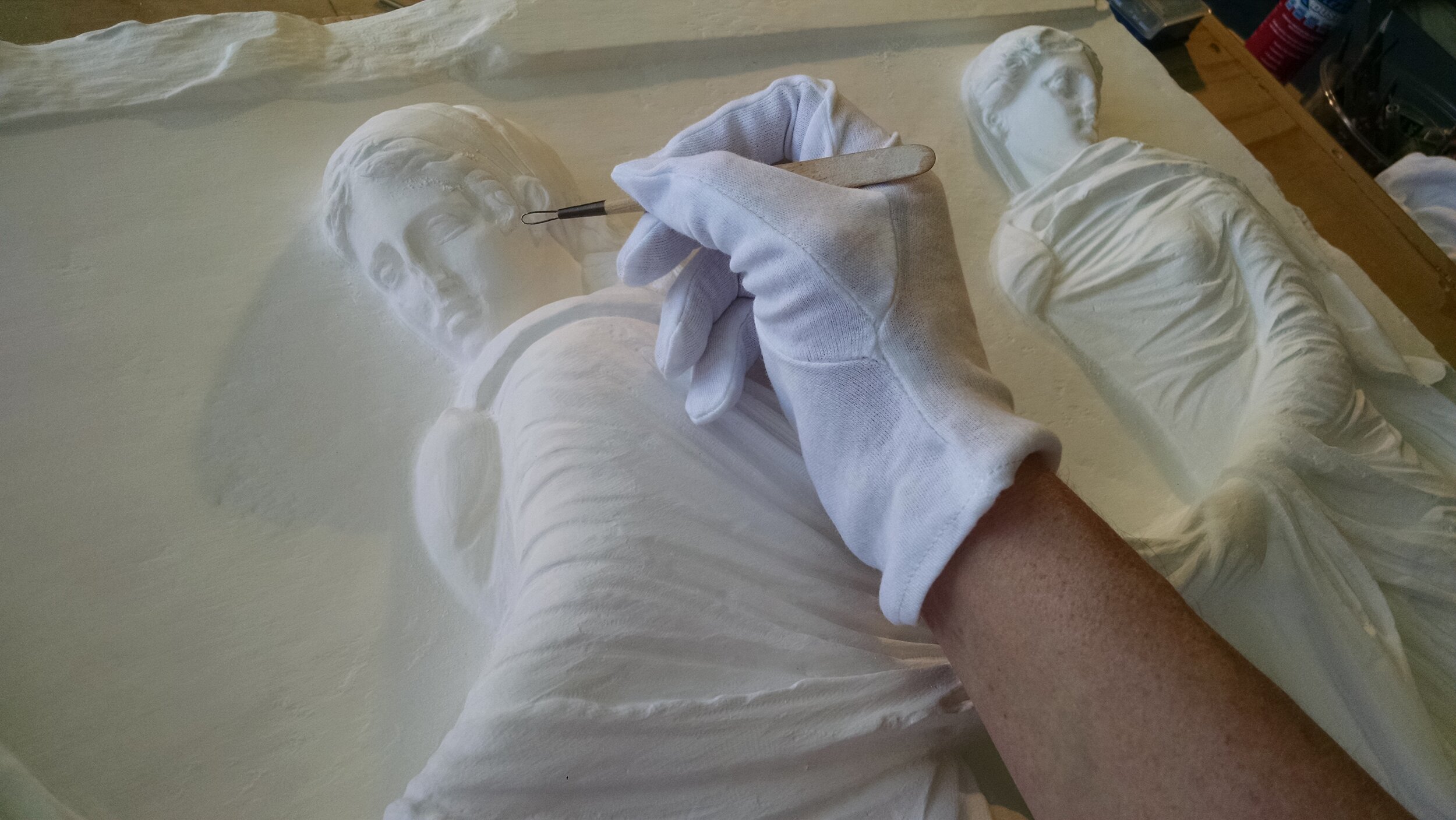   Refining the milled plaster’s details by hand  