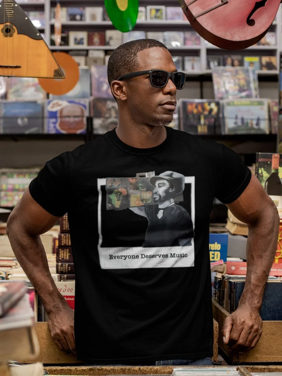 t-shirt-mockup-featuring-a-man-with-sunglasses-at-a-vintage-records-store-30452.jpg