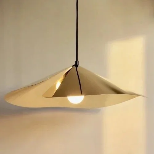 Hand formed Wild Flower pendant lamp light in polished brass inspired by open flower heads