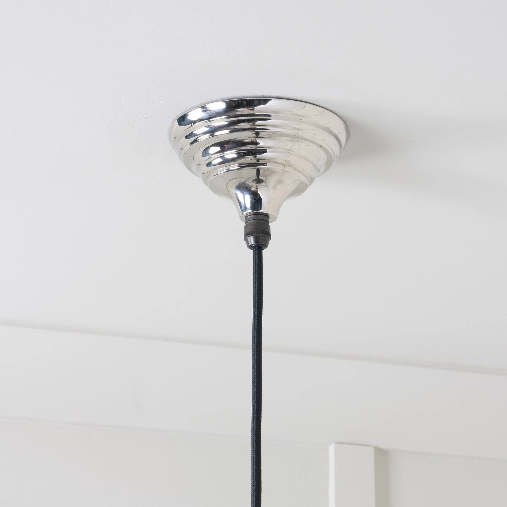 Detail view of Hawthorne pendant lamp in smooth nickel, highlighting artisanal craftsmanship and polished surface