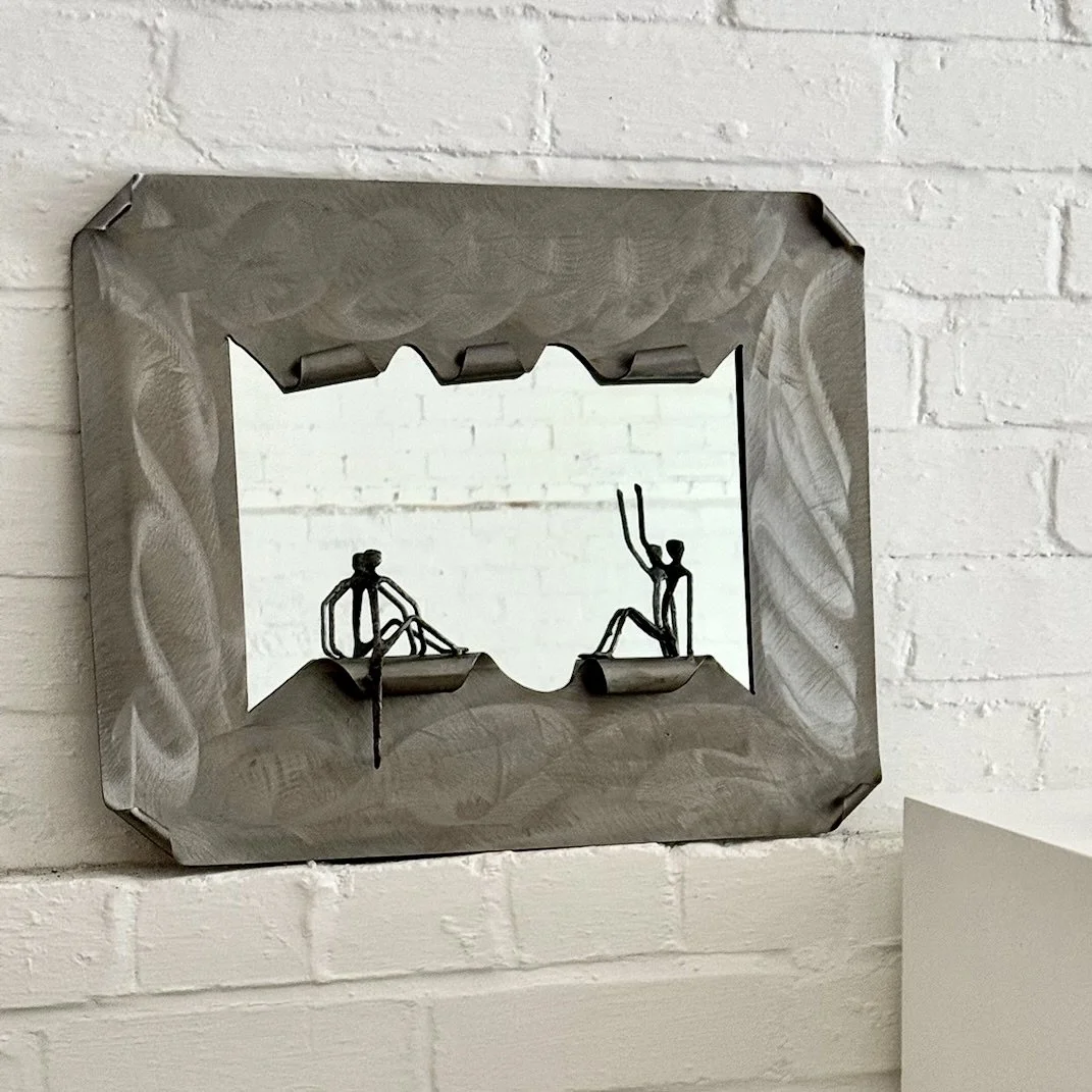 SCULPTURAL STEEL MIRROR