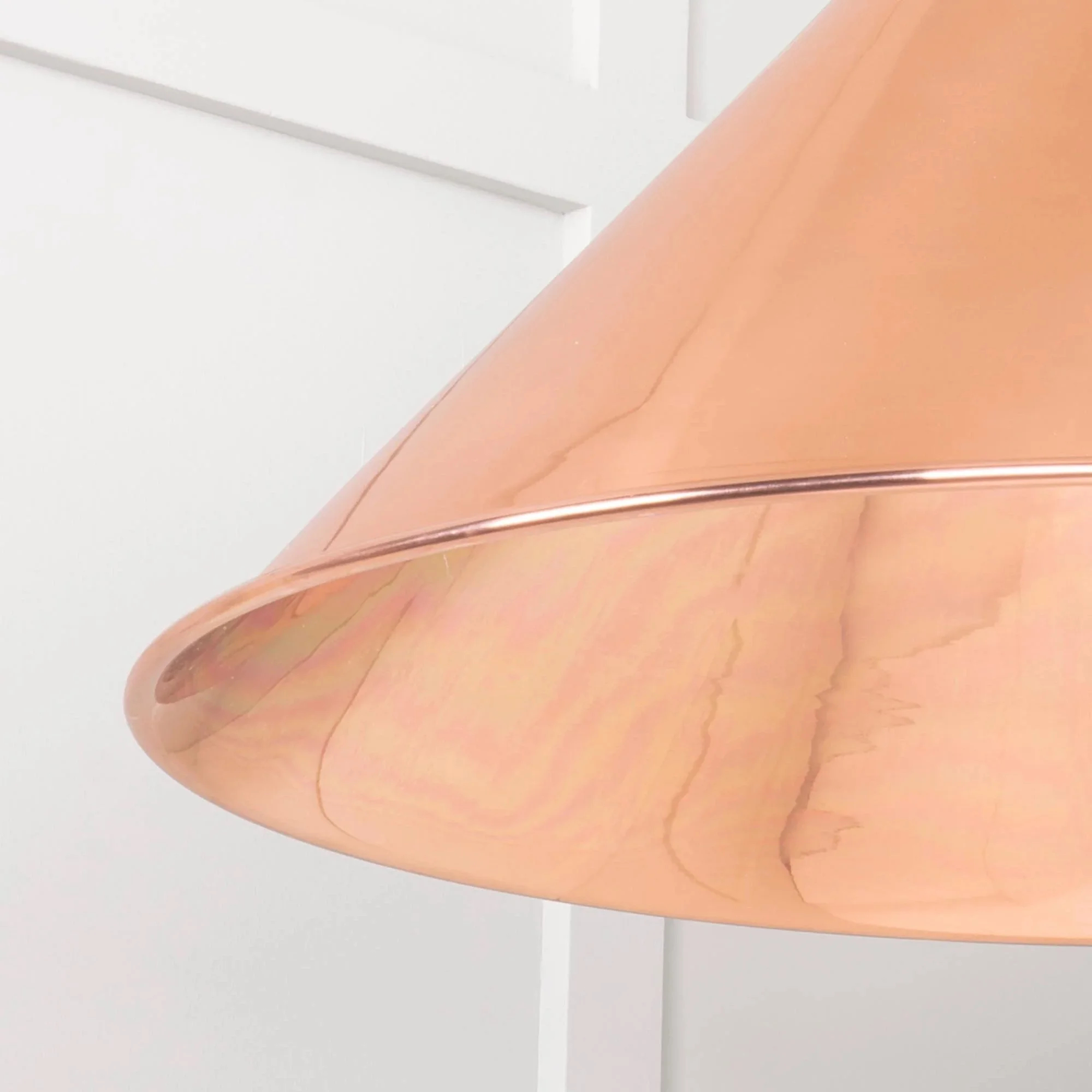 pClose-up of the Hawthorne copper pendant lamp showing hand-aged surface and rich tonal depth.