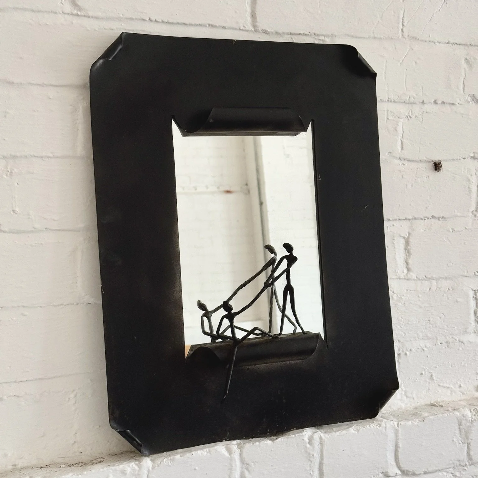 SCULPTURAL STEEL MIRROR