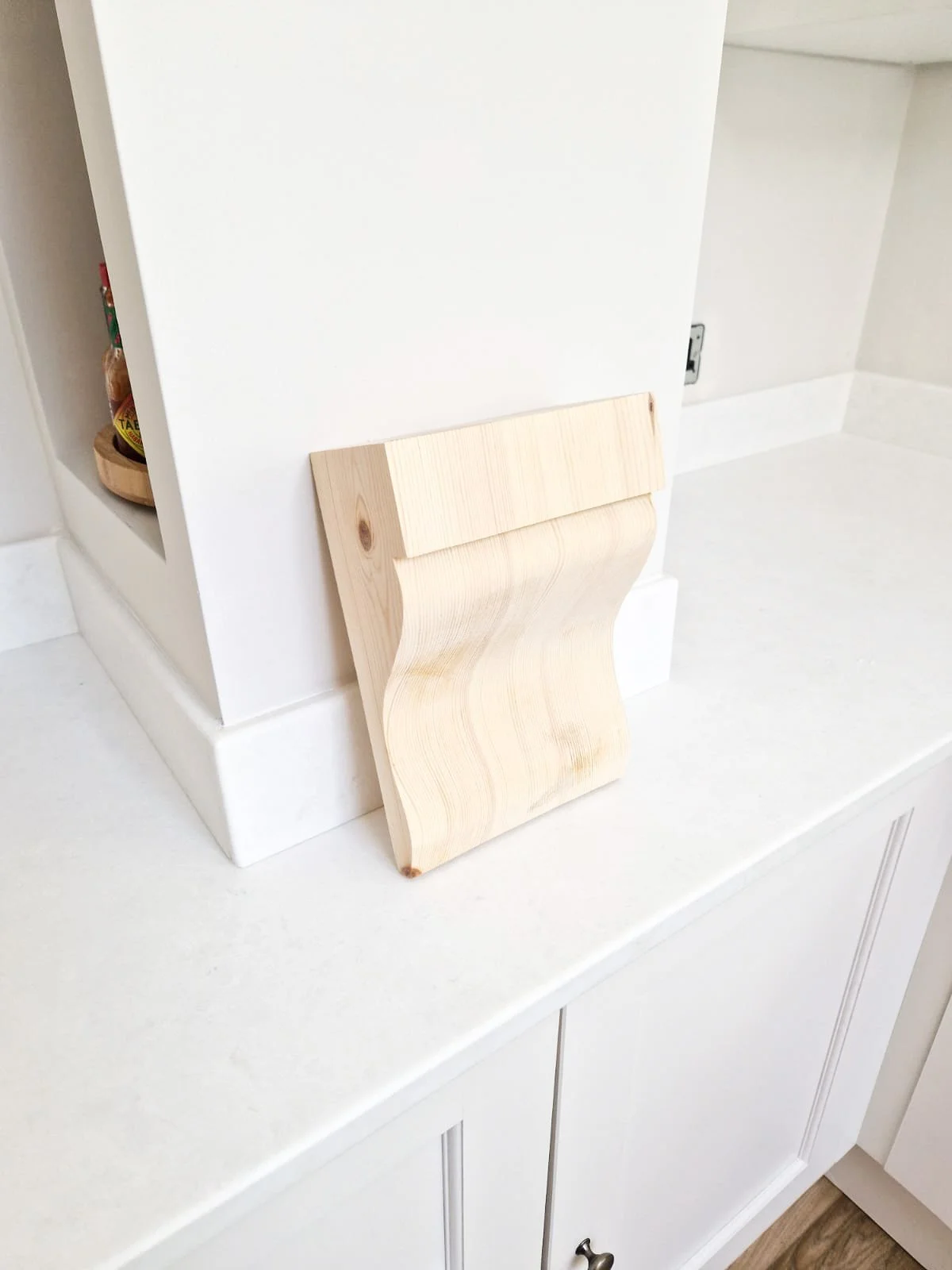 a corbel that will be added to the kitchen mantle