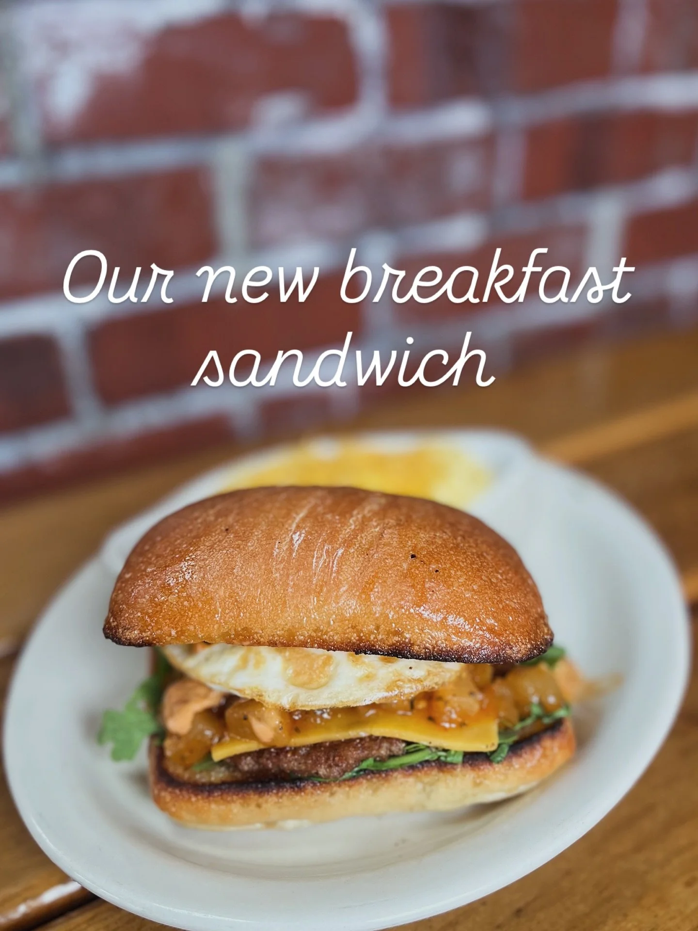 After less than two weeks it&rsquo;s already one of the most popular items on the menu&hellip; we call this the Sweater Weather Breakfast Sando. It features a fried (over medium) egg perched atop fresh arugula, pork sausage, pear-rosemary chutney; wi