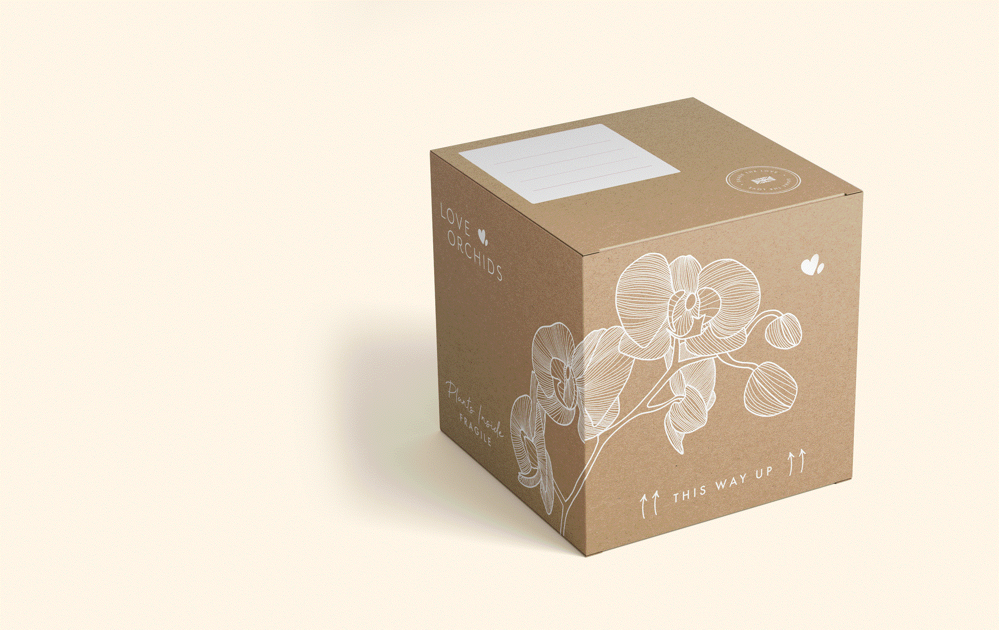 Brown cardboard box with white orchid illustration and text reading Love Orchids on it, placed on a light background.