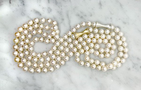 Strand of Pearls with Gold and Silver Trumpet Mystery Clasps