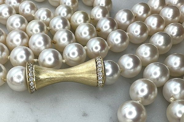 Strand of Pearls with Gold Trumpet Mystery Clasp 