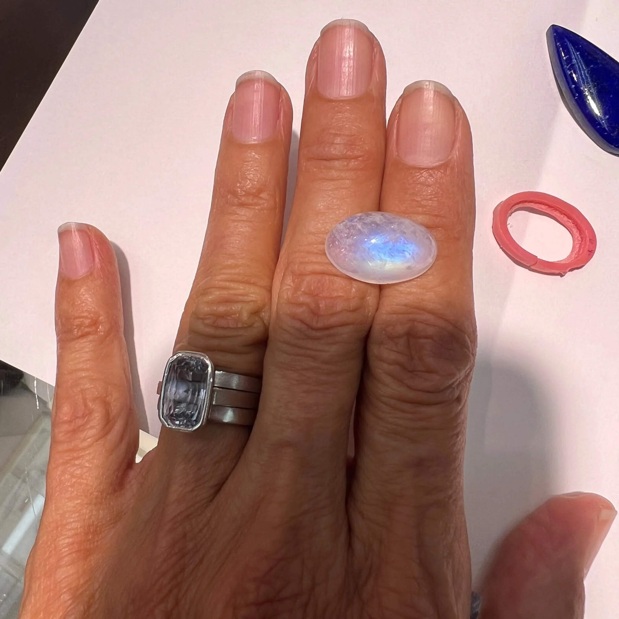Rainbow moonstones cabochons are so fascinating with their colorful glow that moves with the light.  The inclusions make it even more interesting.  I am going to bezel set this one in silver as a ring ..perhaps with some amethyst or sapphire side sto