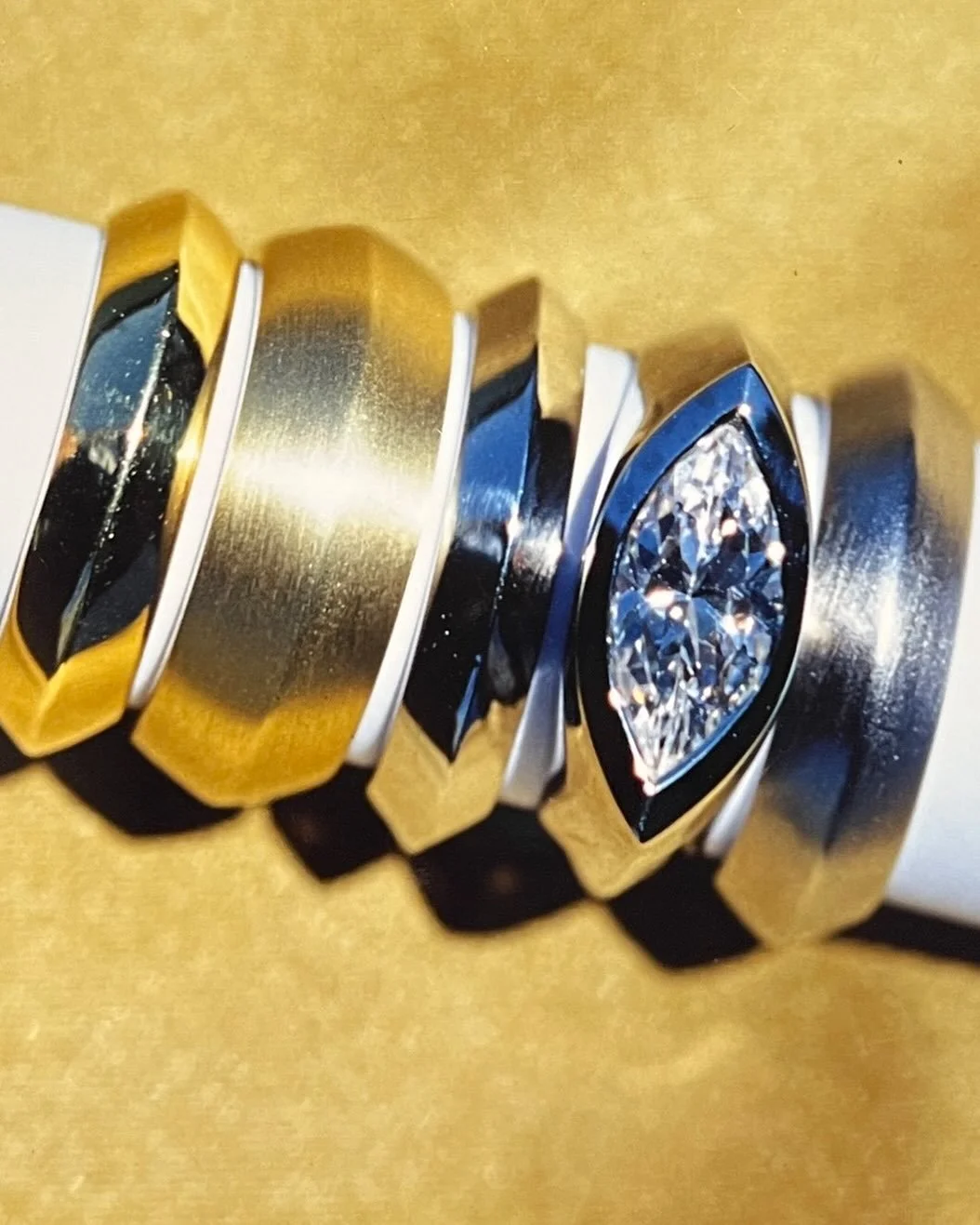 Vintage CED and still looks contemporary!  Gold edge bands stacked or as an engagement ring!  Marquis shaped diamond set east west!

#stackablerings #contemporaryjewelrydesigner #vintageclaudiaendlerdesigns #goldringstavks