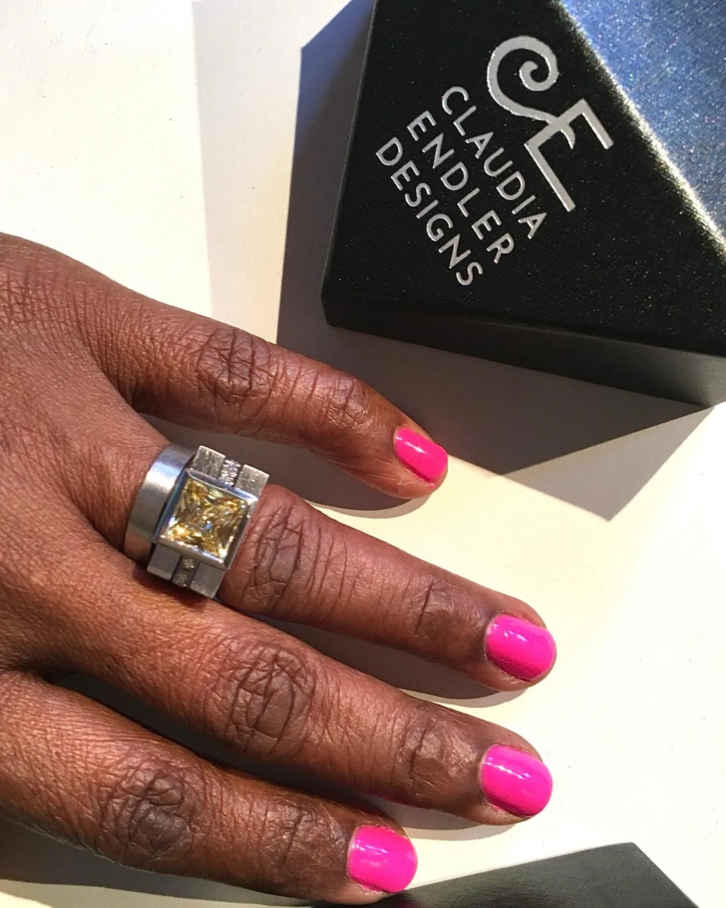 Princess cut yellow sapphire bezel set in white gold with diamond pave&rsquo; band.  A bold statement and wonderful anniversary gift!  #happyanniversary #customjewelrydesigner #contemporaryringdesigns #yellowsapphirering #whitegoldrings💍