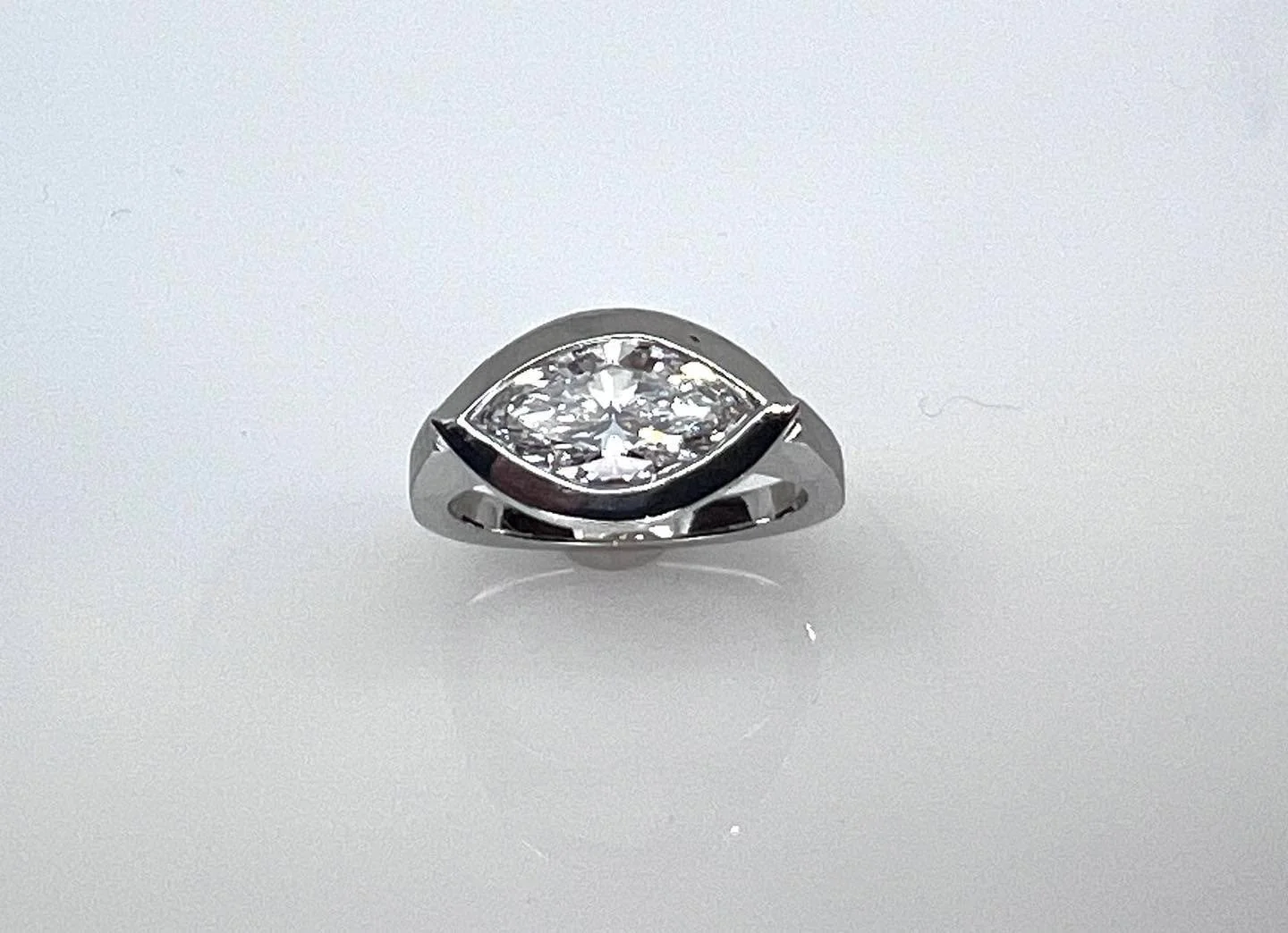 Marquis bezel solitaire ring with peek a boo profile.  Lab grown diamond set in white gold.  Infinitely modern and timeless. 
#marquisdiamondring #labgrowndiamondring #solitair #modernjewlerydesign  #labgrowndiamondrings