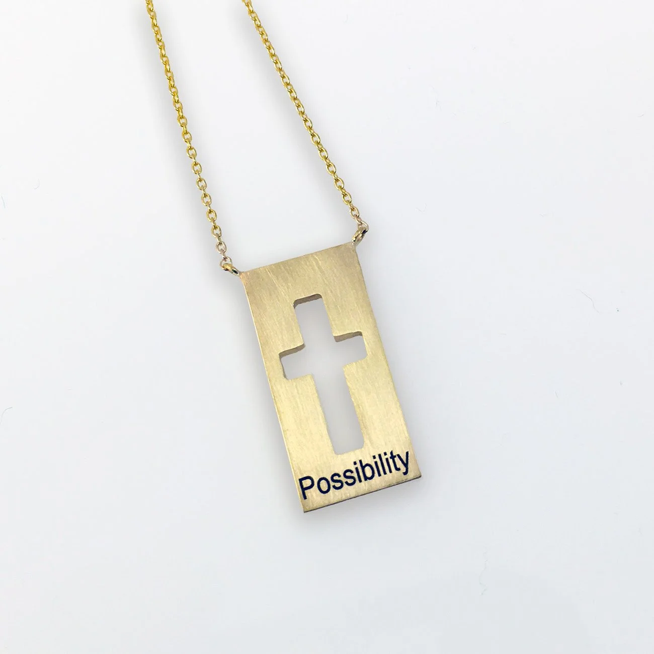 Custom graduation gift designed with the future in mind.
This Faith Pendant was a yellow gold symbol of faith, created for a graduate beginning a new chapter. Engraved with a message about remaining open to possibility, it serves as both a touchstone
