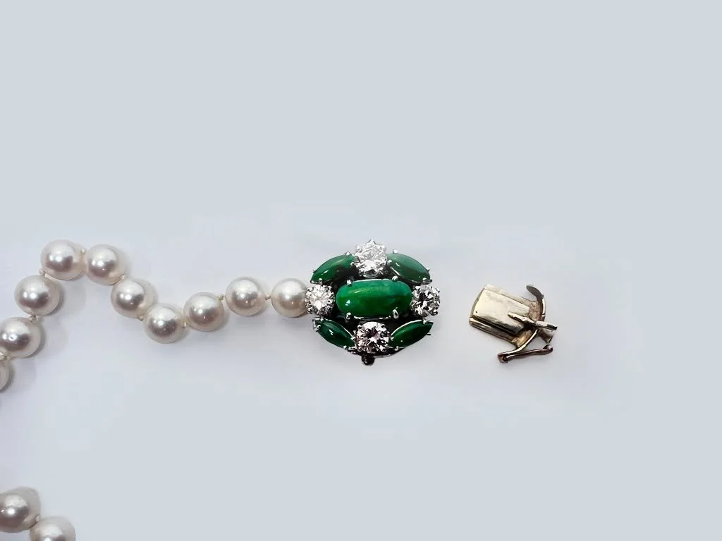 Transforming and heirloom from something a bit dated to something more contemporary.  This stunning jade and diamond clasp was attached to a pearl strand from my client's mother.  We took off the clasp part and created a simple bail and suspending it