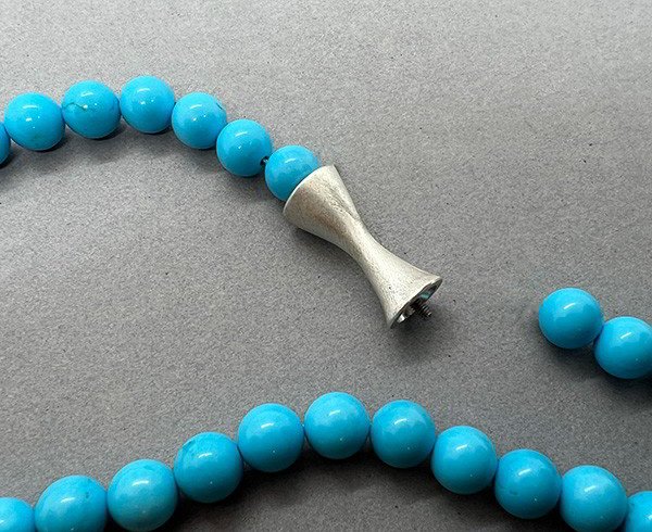 Strand of Turquoise Beads with Silver Trumpet Mystery Clasp