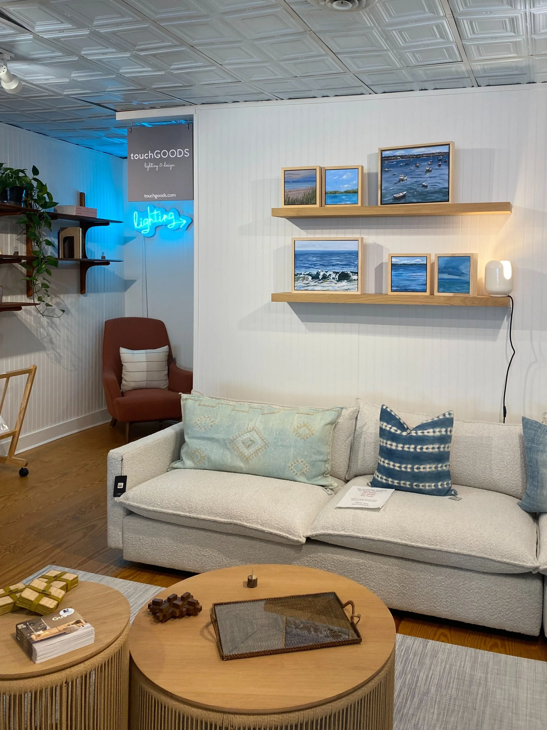 Various coastal scenes, ranging from 8x8" to 12x16", displayed in TouchGOODS