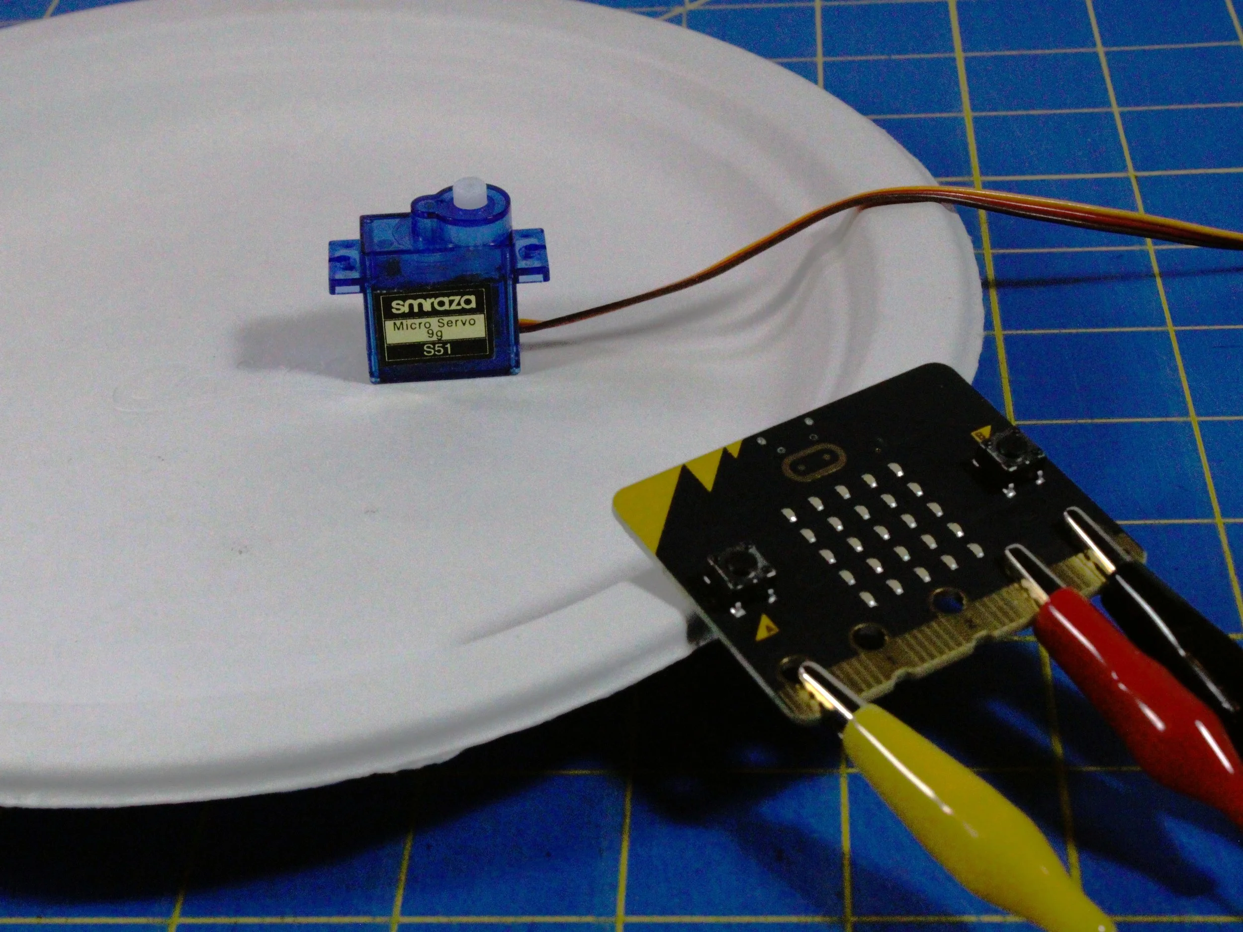 1. Tape 1st motor to base near edge