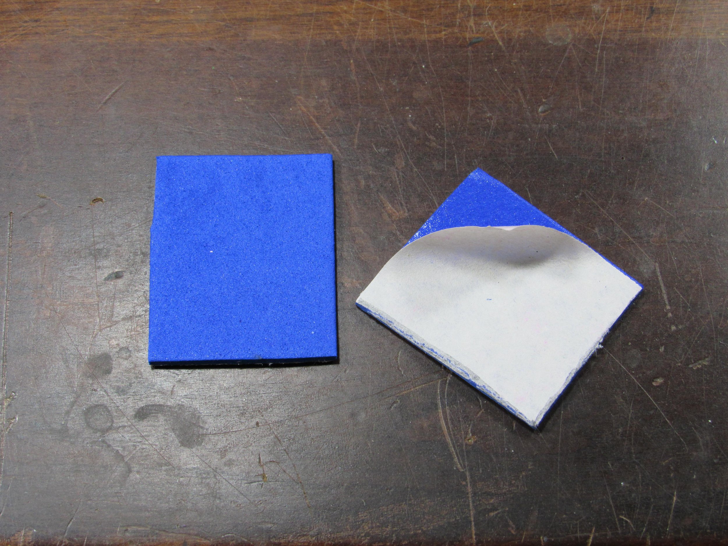Cut out the peel-and-stick foam