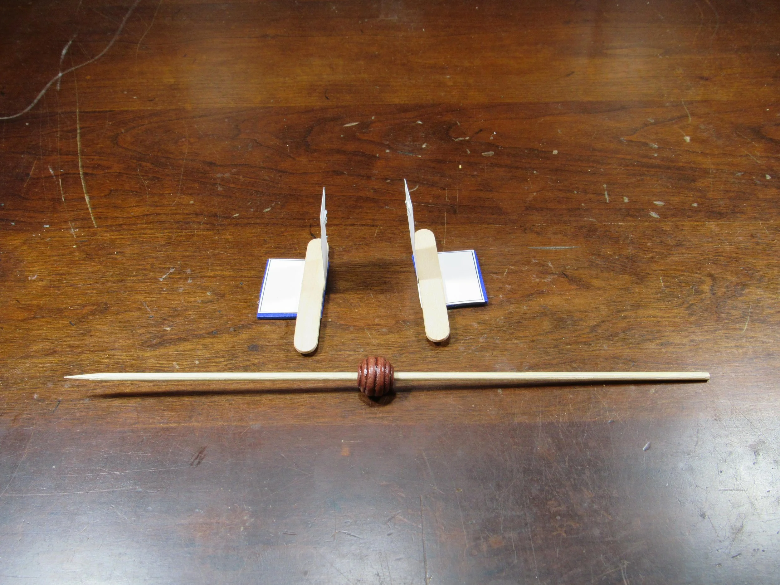 Slide "head" bead in middle, then left and right feet