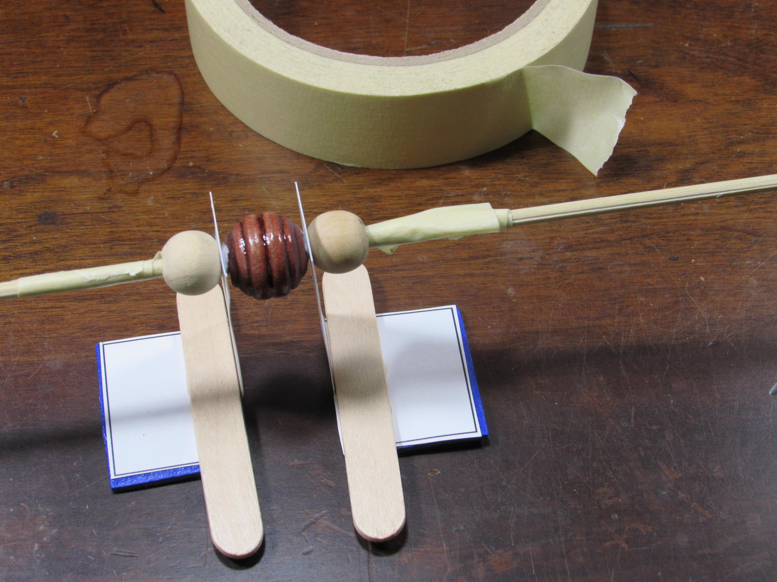 Use masking tape to hold beads in place