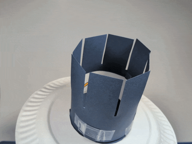 Punch hole in plate. Rest plate on fist, spin with other hand.