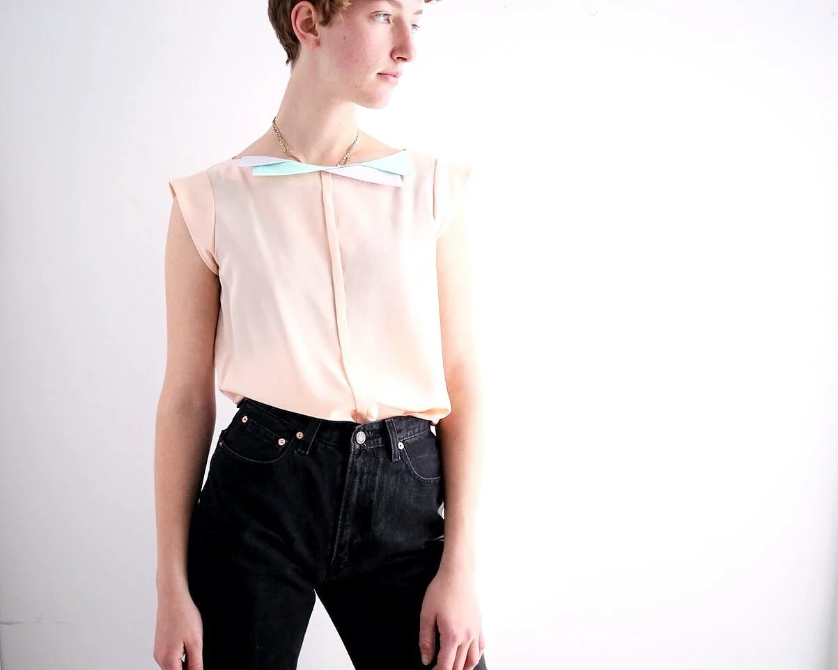 1980s silk blouse with cap sleeves and geometric detailed neckline