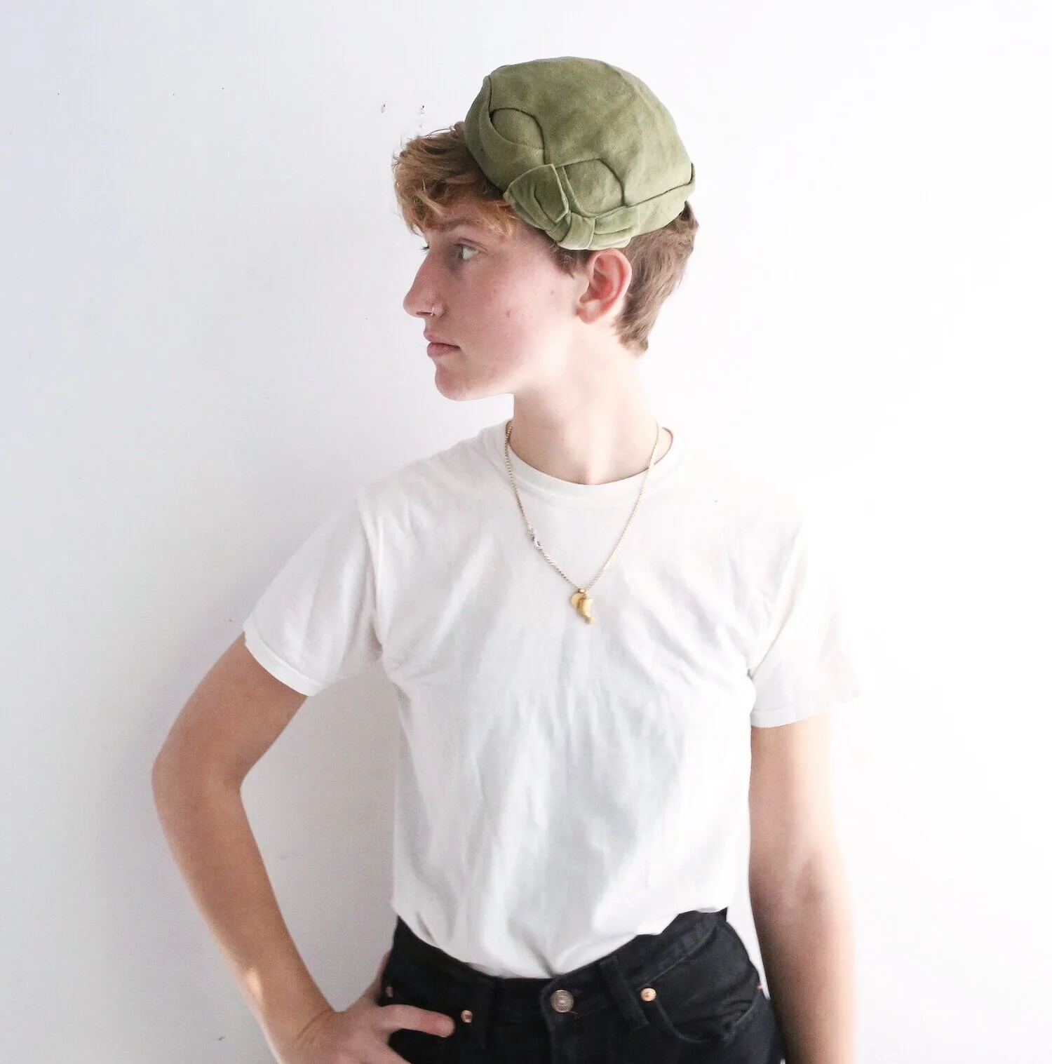 1950s handwoven green straw pillbox hat.