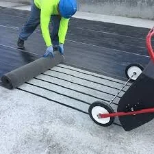 Commercial roofer installing a modified bitumen roofing membrane system.
