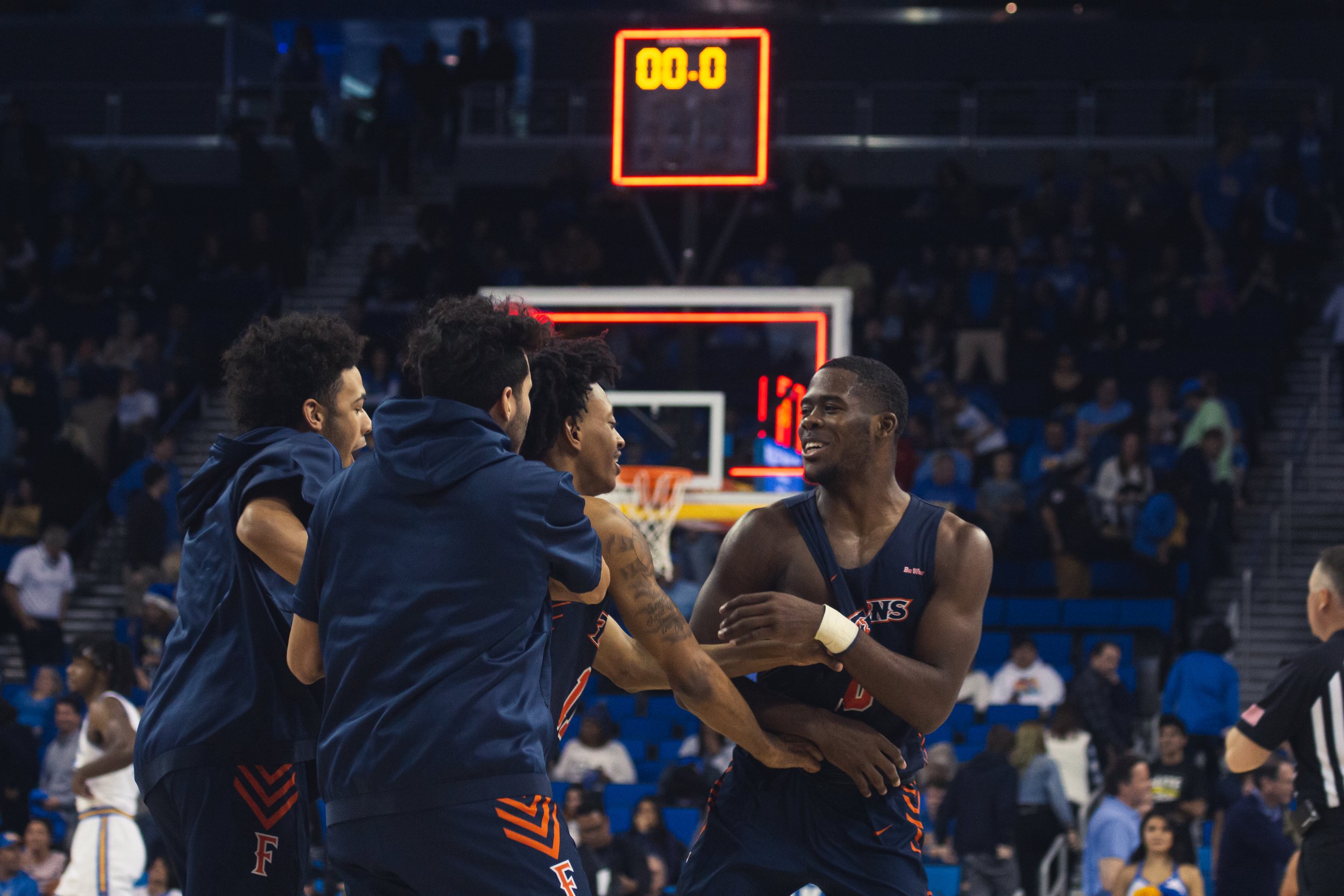 Cal State Fullerton Men's Basketball upsets UCLA at Pauley Pavilion on December 28, 2019 by the final score of 77-74 with the help of late scoring and a steal by Titans guard Austen Awosika (right). It was only CSUF's second ever victory against UCLA