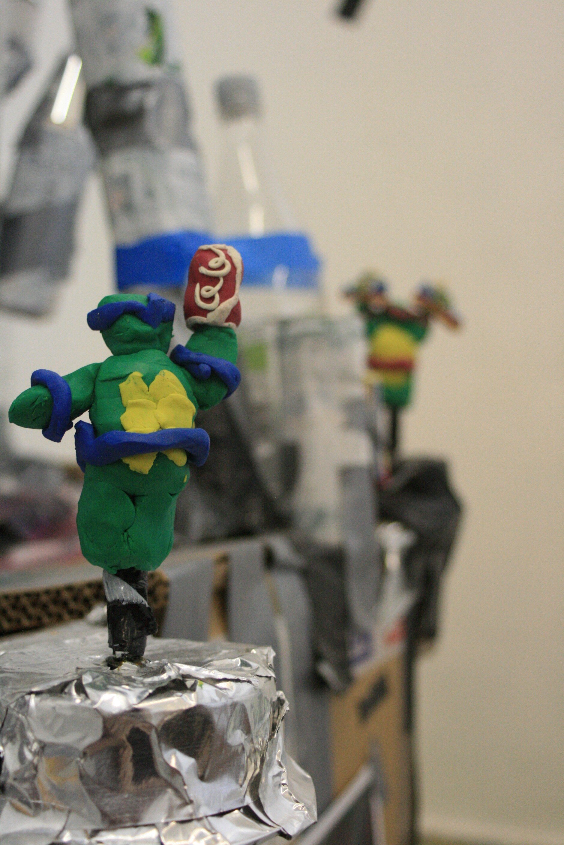 Leonardo holding a coke - 2009, installation detail; plastercine and mirror ball motor