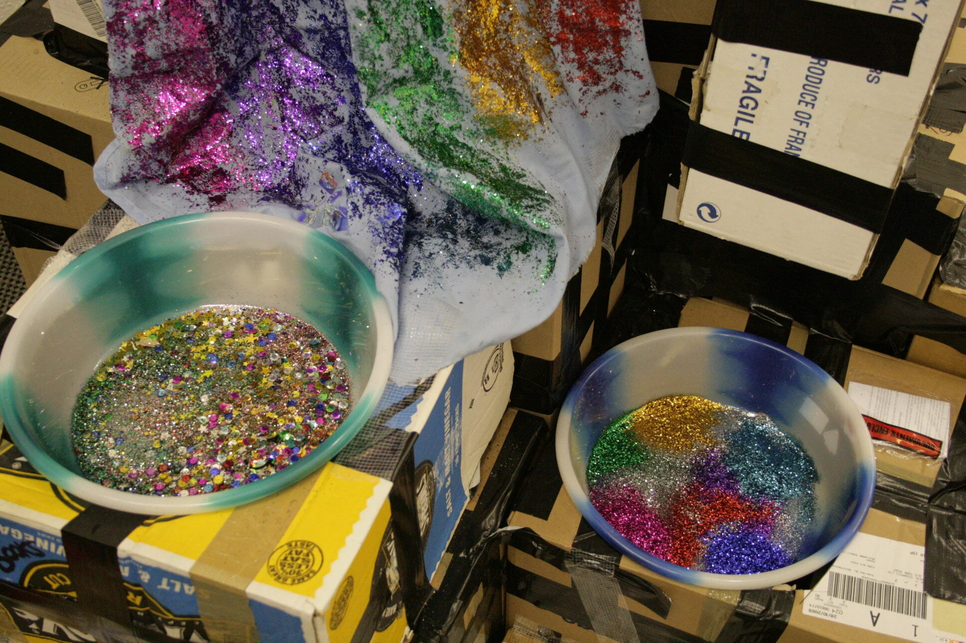 Waterfall - 2009, installation detail; painted cloth, cardboard, tape, plastic bowls, glitter