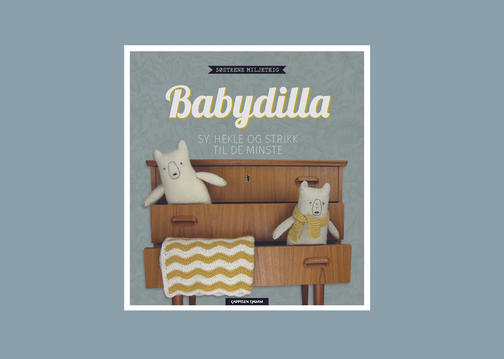  Design av boken «Babydilla» av Søstrene Miljeteig. 