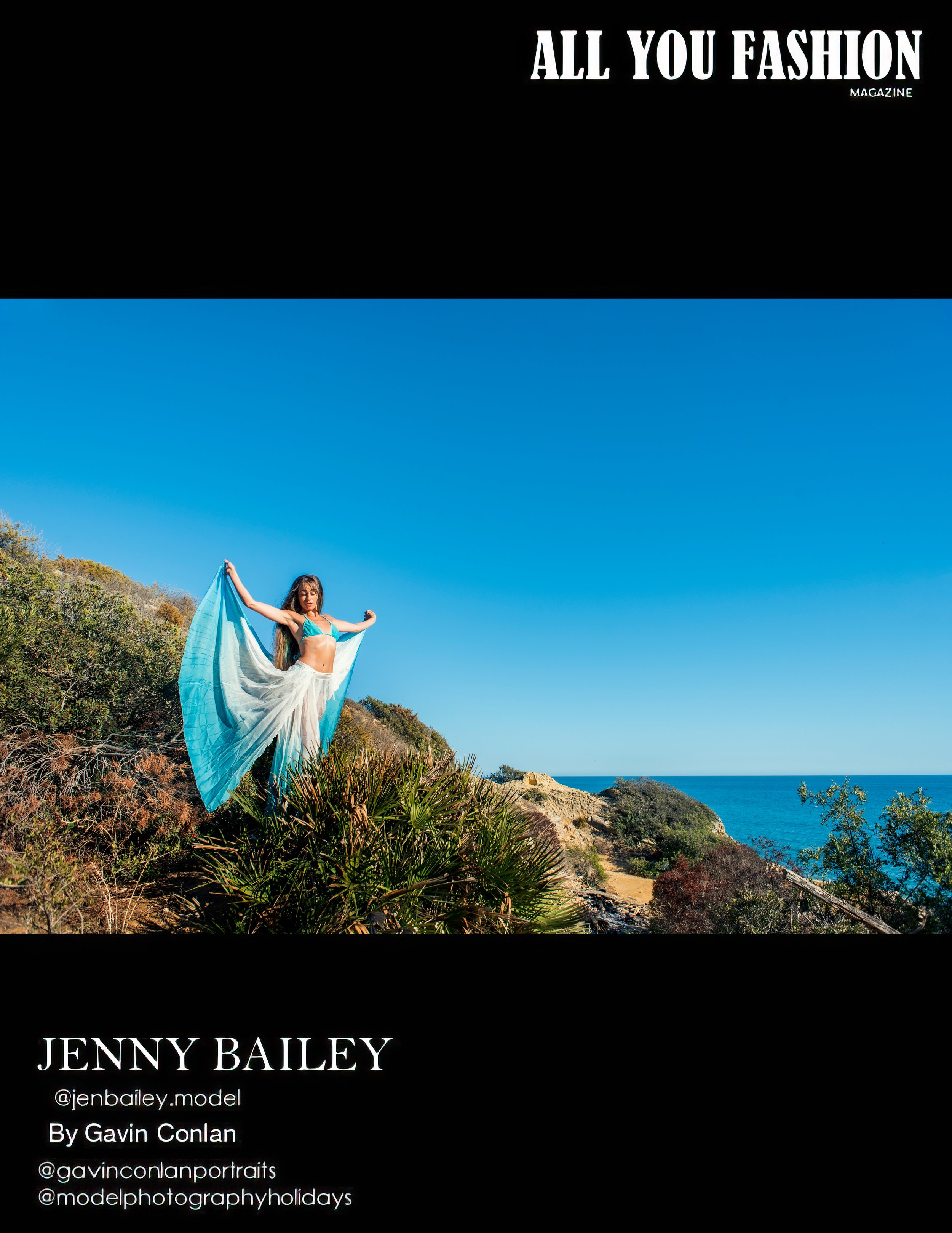 Fashion magazine cover featuring a woman in a flowing blue dress standing on a natural landscape with greenery and a view of the ocean under a clear blue sky.
