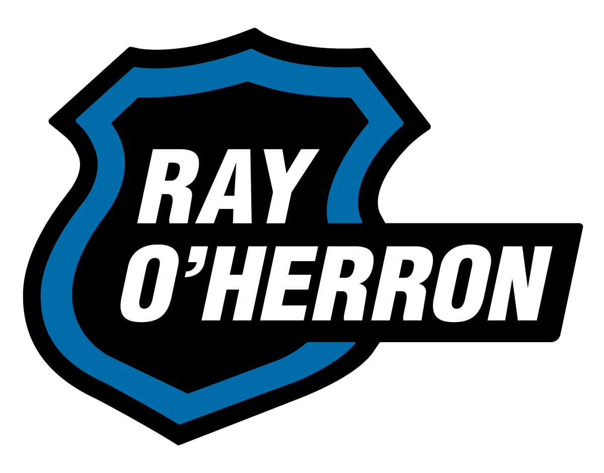 Logo with the name Ray O'Herron inside a stylized blue shield shape.