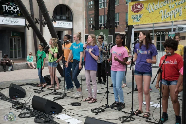 A group singing on a stage
